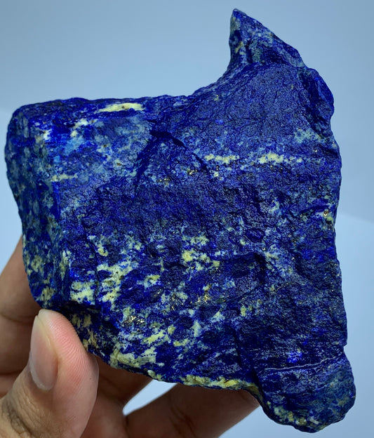 Close-up of Lazurite matrix showing indigo blue tone
Broad Lapis Lazuli specimen, top view
Raw Lapis Lazuli showing natural Calcite pockets