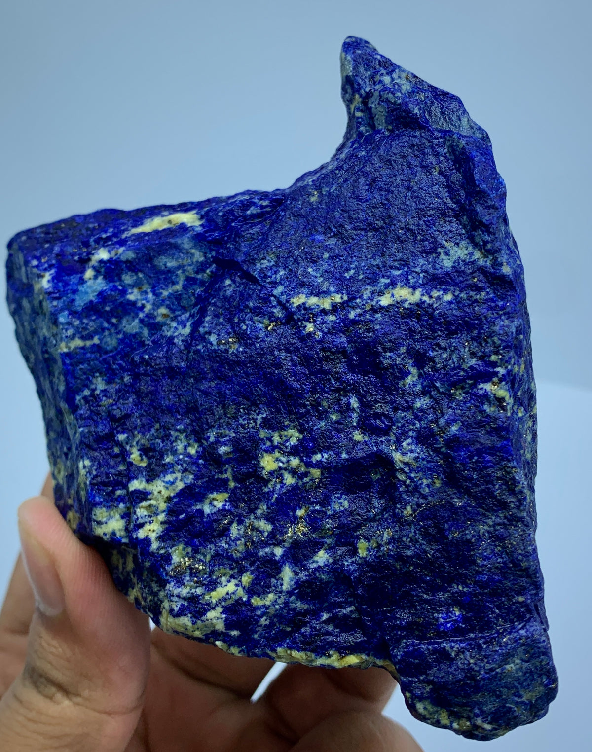 Lapis Lazuli specimen, angled view highlighting depth
Broad Lapis Lazuli specimen, full piece overview
Detail shot of Lazurite blue coloring on rough specimen
Lapis Lazuli specimen displayed against neutral background
Lapis Lazuli rough stone, macro detail of matrix texture