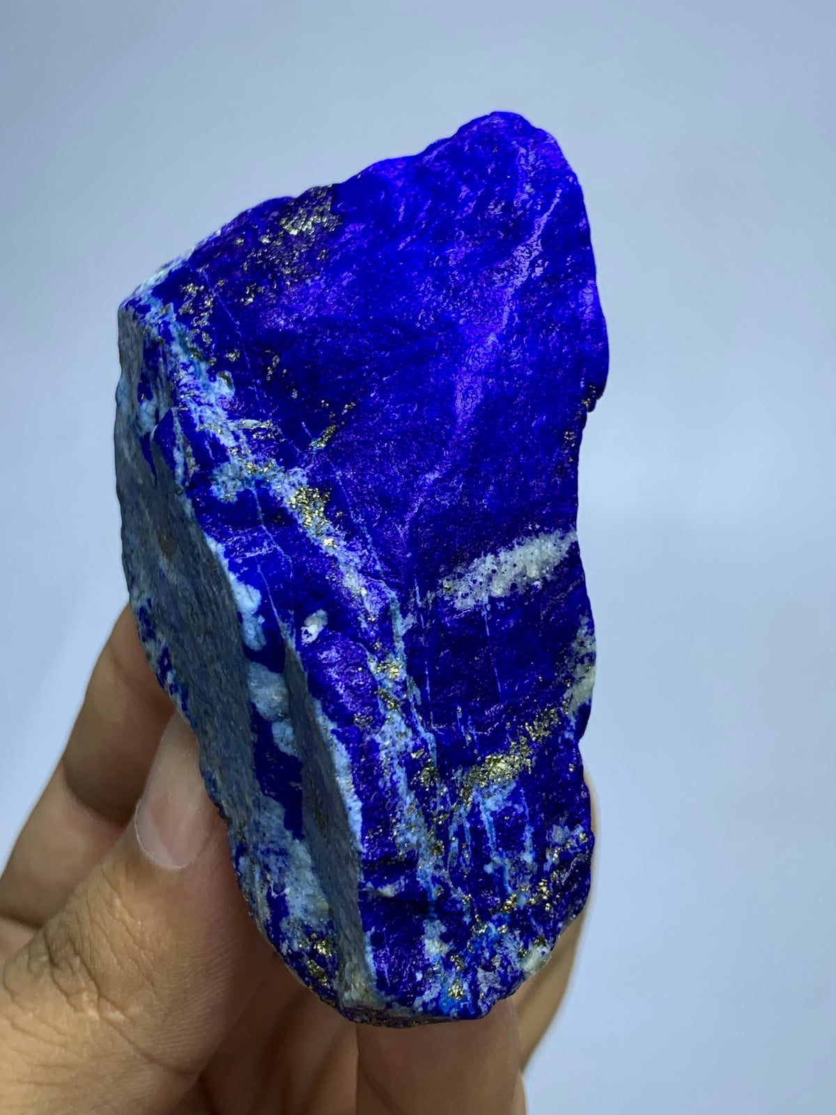 Balanced Lapis Lazuli specimen, top view
Raw Lapis Lazuli showing natural Calcite pockets
Afghan Lapis Lazuli specimen, side profile view
141g raw Lapis Lazuli specimen with Pyrite veins