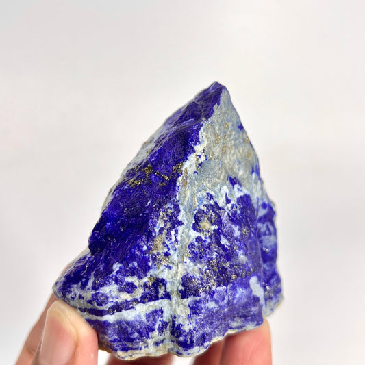 Close-up of Lazurite matrix showing indigo blue tone
Balanced Lapis Lazuli specimen, top view
Raw Lapis Lazuli showing natural Calcite pockets
Afghan Lapis Lazuli specimen, side profile view
160g raw Lapis Lazuli specimen with Pyrite veins
Lapis Lazuli rough specimen, front angle, deep blue color
Close-up view of Pyrite veins on Lapis Lazuli specimen
Badakhshan Lapis Lazuli specimen, natural rough texture