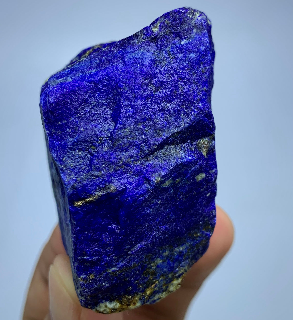 Close-up of Lazurite matrix showing indigo blue tone
Lapis Lazuli cube-like specimen, top view
Raw Lapis Lazuli showing natural Calcite pockets
Afghan Lapis Lazuli specimen, side profile view
174g raw Lapis Lazuli specimen with Pyrite inclusions
Lapis Lazuli rough specimen, front angle, deep blue color
Close-up view of Pyrite veins on Lapis Lazuli specimen
Badakhshan Lapis Lazuli specimen, natural rough texture