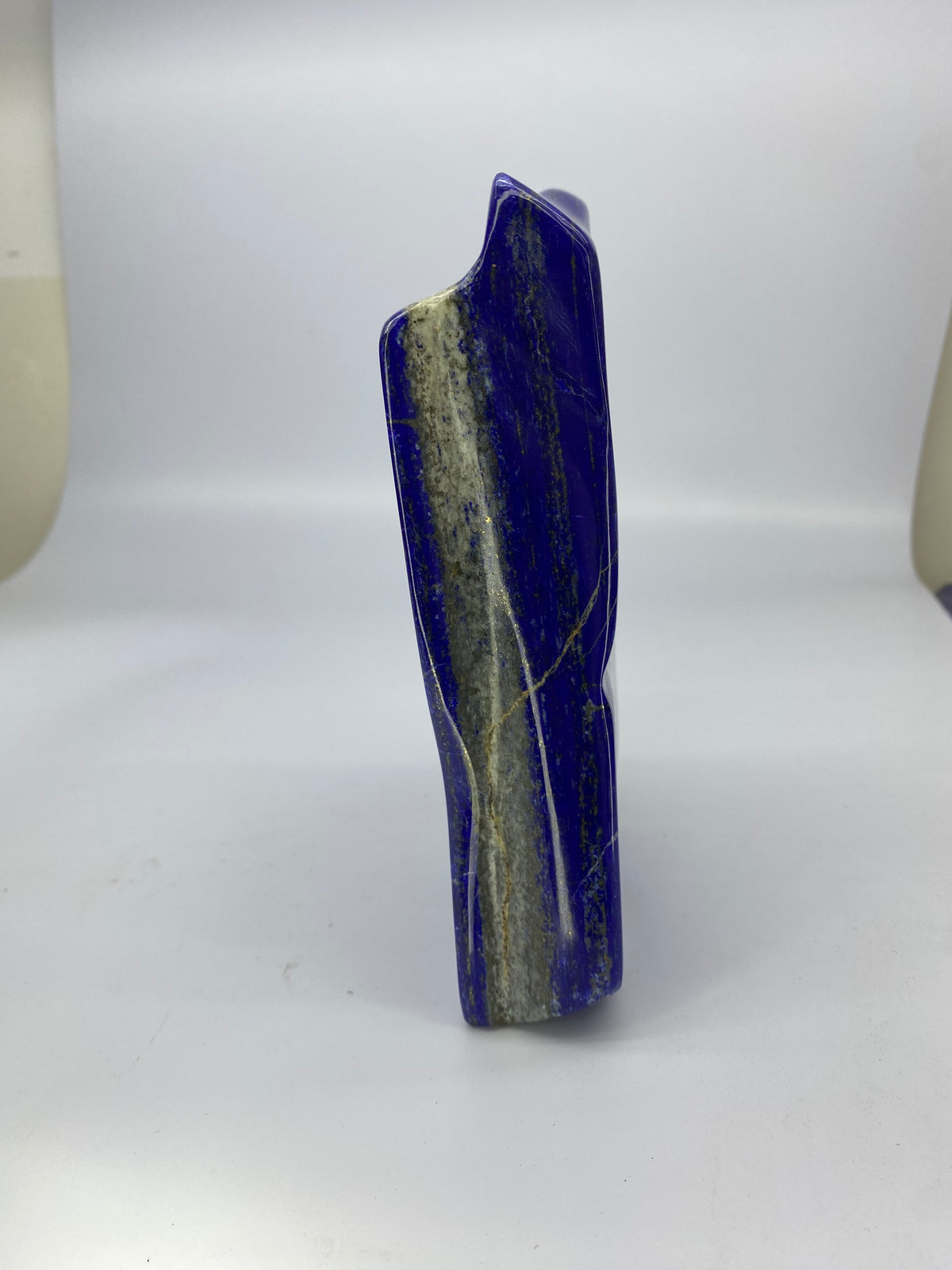 19 by 14 cm face of the polished Lapis Lazuli
Lapis Lazuli block standing upright on its base