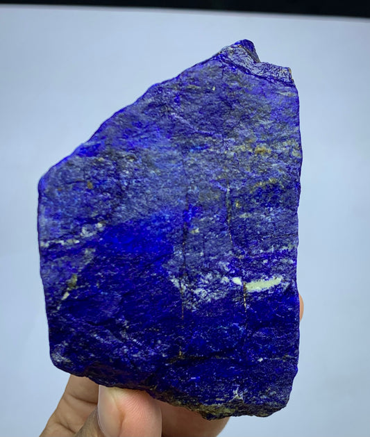 318g raw Lapis Lazuli specimen from Badakhshan
Blocky Lapis Lazuli specimen with golden Pyrite
Close-up of royal blue Lapis Lazuli surface