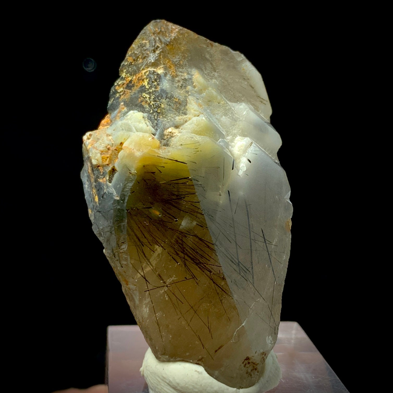 This is a stunning, high-grade Terminated Black Rutile Quartz Crystal specimen, weighing 168 carats. This piece is a rare find, sourced from the world-famous Zagi Mountain Mine, Pakistan, a locality renowned for producing exceptionally fine and highly sought-after Rutilated Quartz.

The crystal is characterized by its sharp, natural termination and excellent clarity, allowing full view of the dense, needle-like Black Rutile inclusions. The Rutile appears as dramatic, black filaments frozen within the clear 