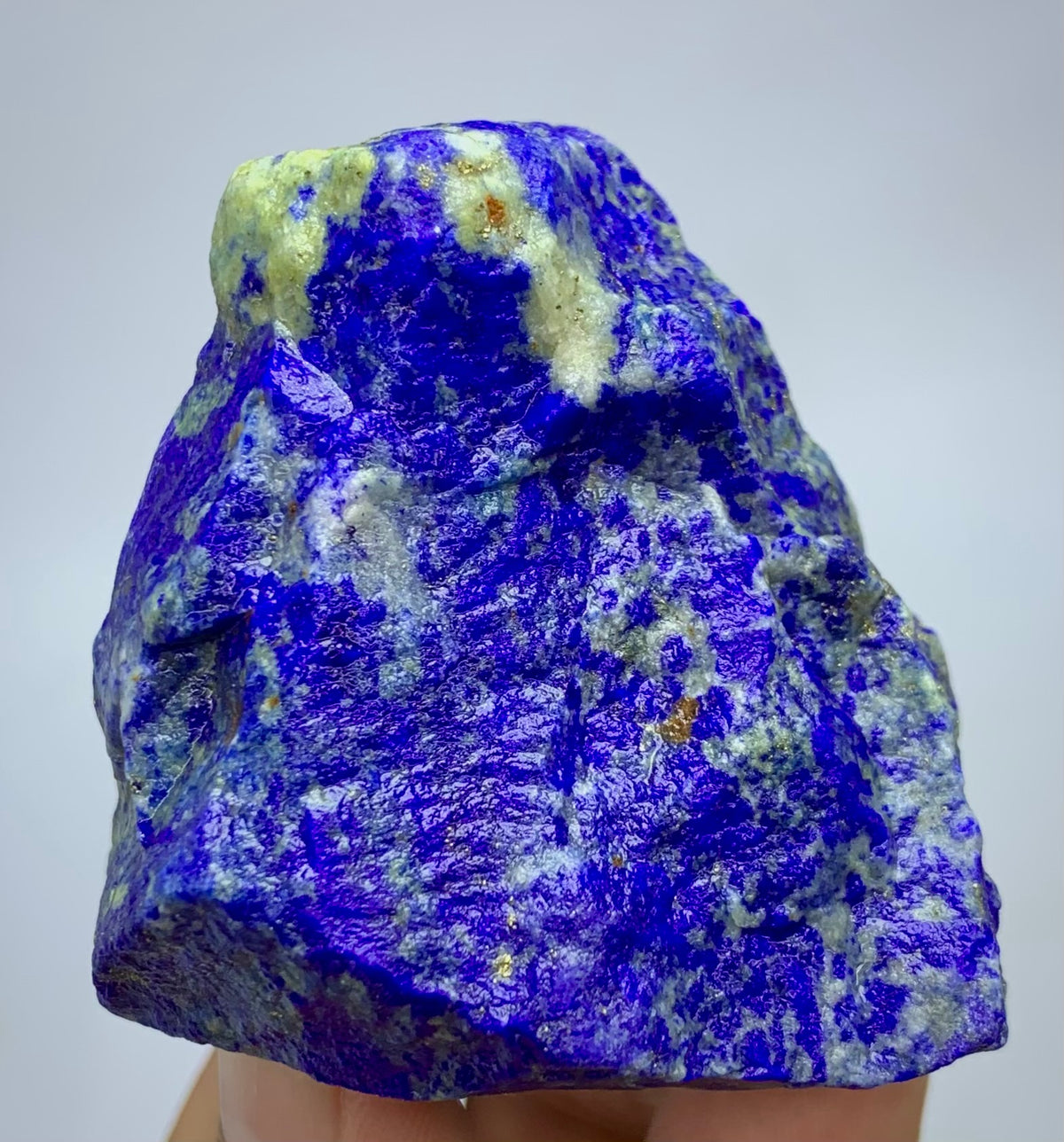 Raw Lapis lazuli crystal specimen with deep blue and white marbled patterns