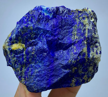 Lapis Lazuli rough specimen, front angle, royal blue color
Close-up view of gold Pyrite veins on Lapis Lazuli
Badakhshan Lapis Lazuli specimen, natural rough texture
