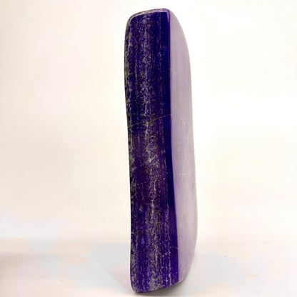 Close view of Pyrite veining on glossy surface
Reflective polish on deep ultramarine Lapis Lazuli