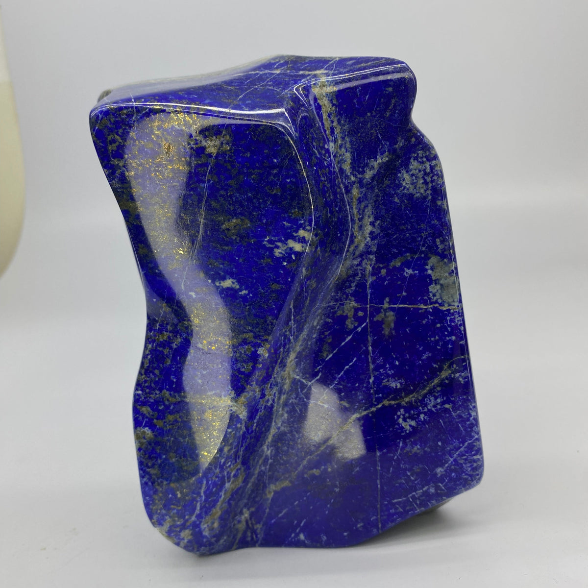 Close view of golden pyrite clouds in Lapis Lazuli
Lapis Lazuli block standing upright on its base
Angled view of 18.0 cm polished Lapis