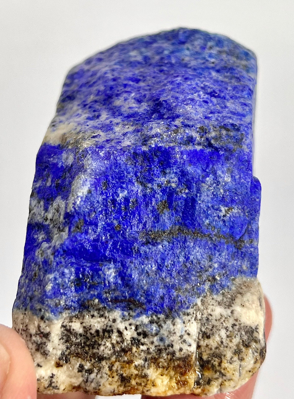 Dense Lazurite crystal surface close-up
Lapis Lazuli block viewed from top angle