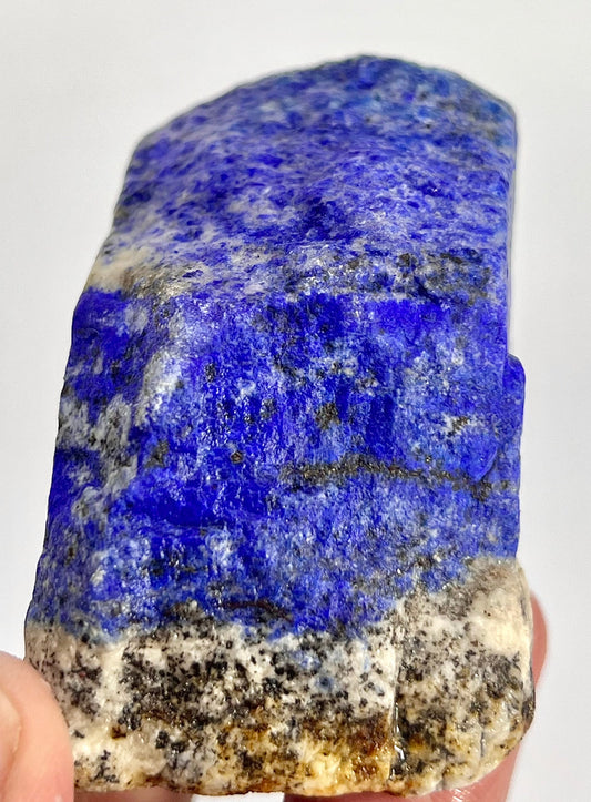 Dense Lazurite crystal surface close-up
Lapis Lazuli block viewed from top angle