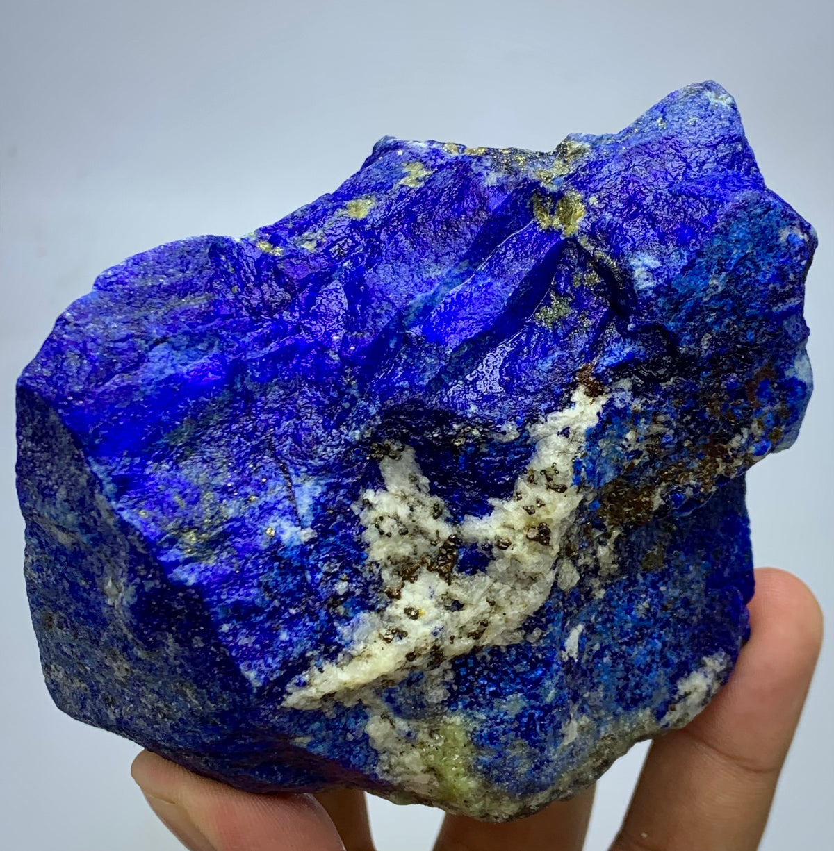 Raw Lapis Lazuli specimen showing white Calcite streaks
Afghan Lapis Lazuli, angled view highlighting depth
Square-profile Lapis Lazuli specimen, full piece overview