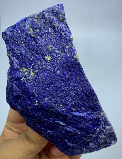 Afghan Lapis Lazuli, natural unpolished surface detail
Lapis Lazuli specimen displayed against neutral background
Lapis Lazuli rough stone, macro deta