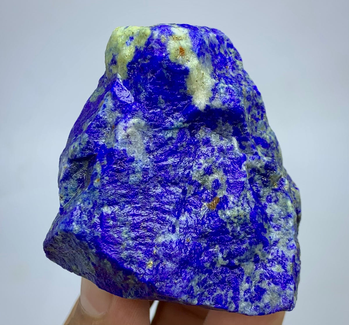 Raw Lapis lazuli crystal specimen with deep blue and white marbled patterns