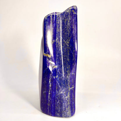 Glossy Lazurite surface with metallic veining
Overhead view of polished Lapis Lazuli block