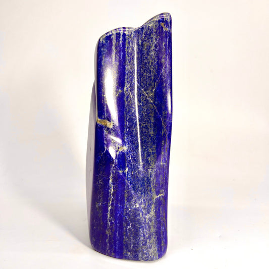 Glossy Lazurite surface with metallic veining
Overhead view of polished Lapis Lazuli block