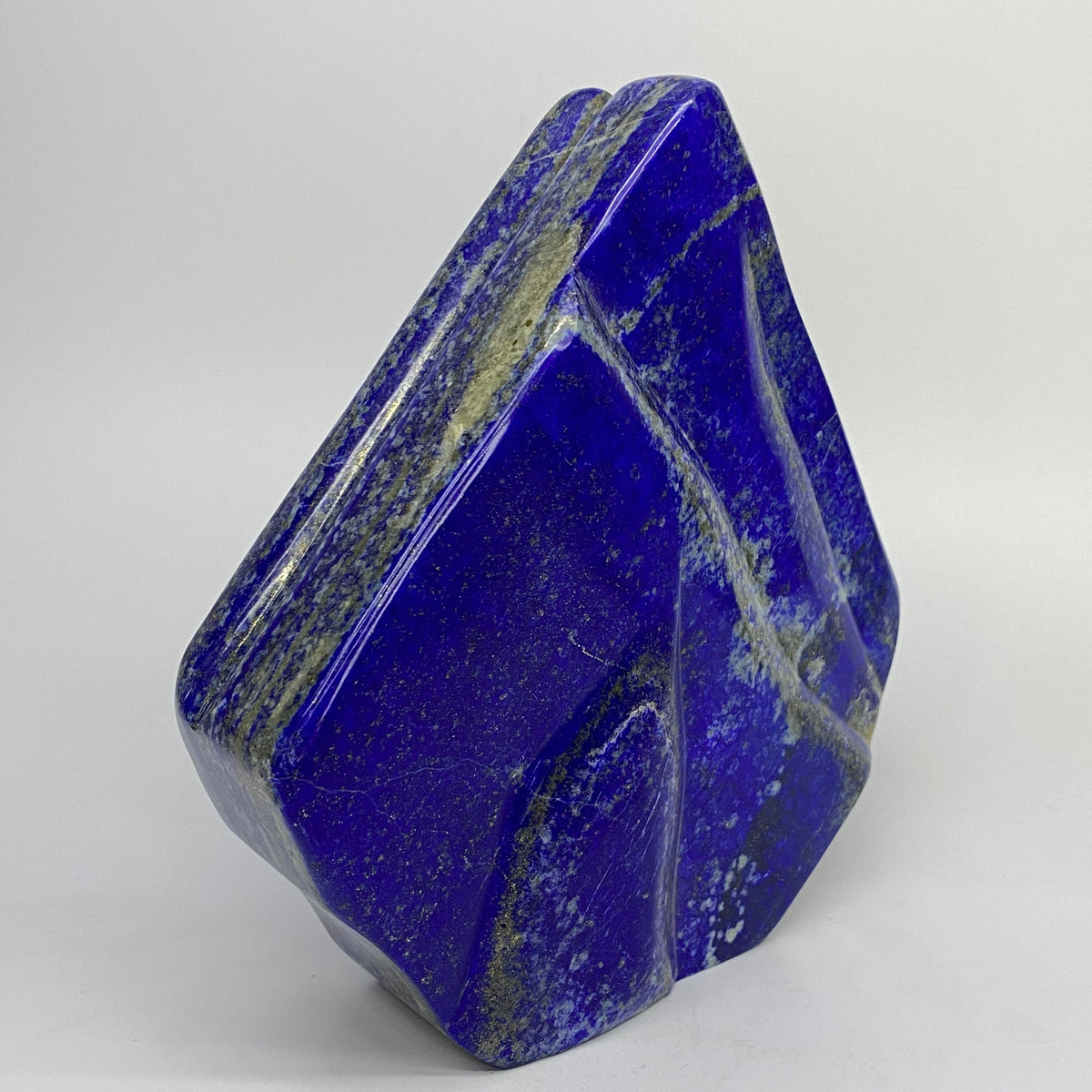Glossy Lazurite surface with scattered gold flecks
Overhead view of large square polished Lapis Lazuli