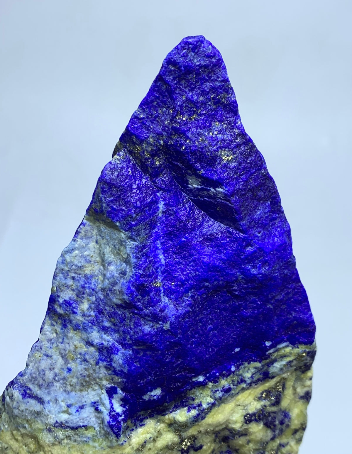 Gold Pyrite veins across pointed Lapis surface
White Calcite paths on jagged Lapis Lazuli