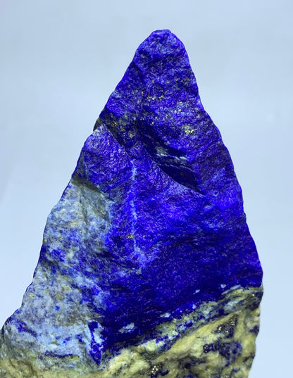 Gold Pyrite veins across pointed Lapis surface
White Calcite paths on jagged Lapis Lazuli