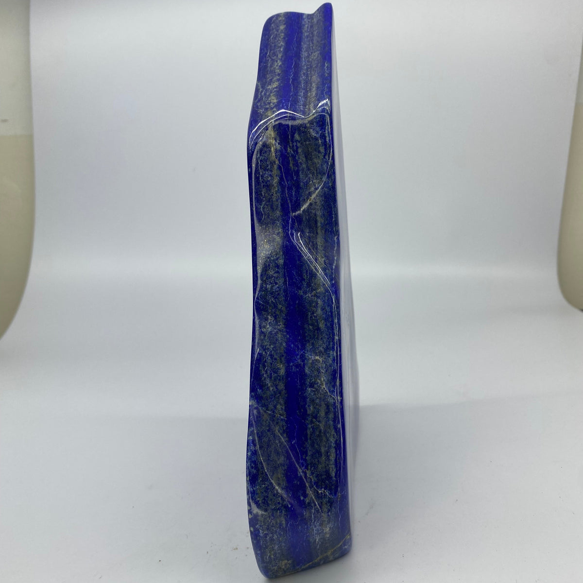 Lapis Lazuli block lying flat, seen from above
Light glancing across the reflective Lapis face
