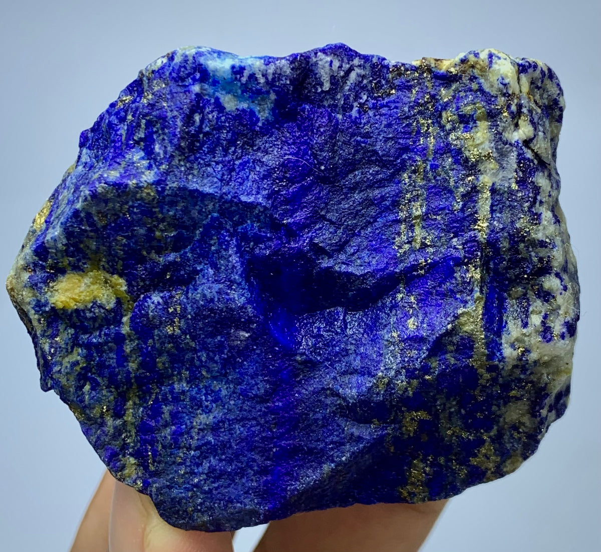 Raw Lapis Lazuli specimen showing white Calcite streaks
Afghan Lapis Lazuli, angled view highlighting depth
Lapis Lazuli blocky specimen, full piece overview
Detail shot of royal blue coloring on rough specimen