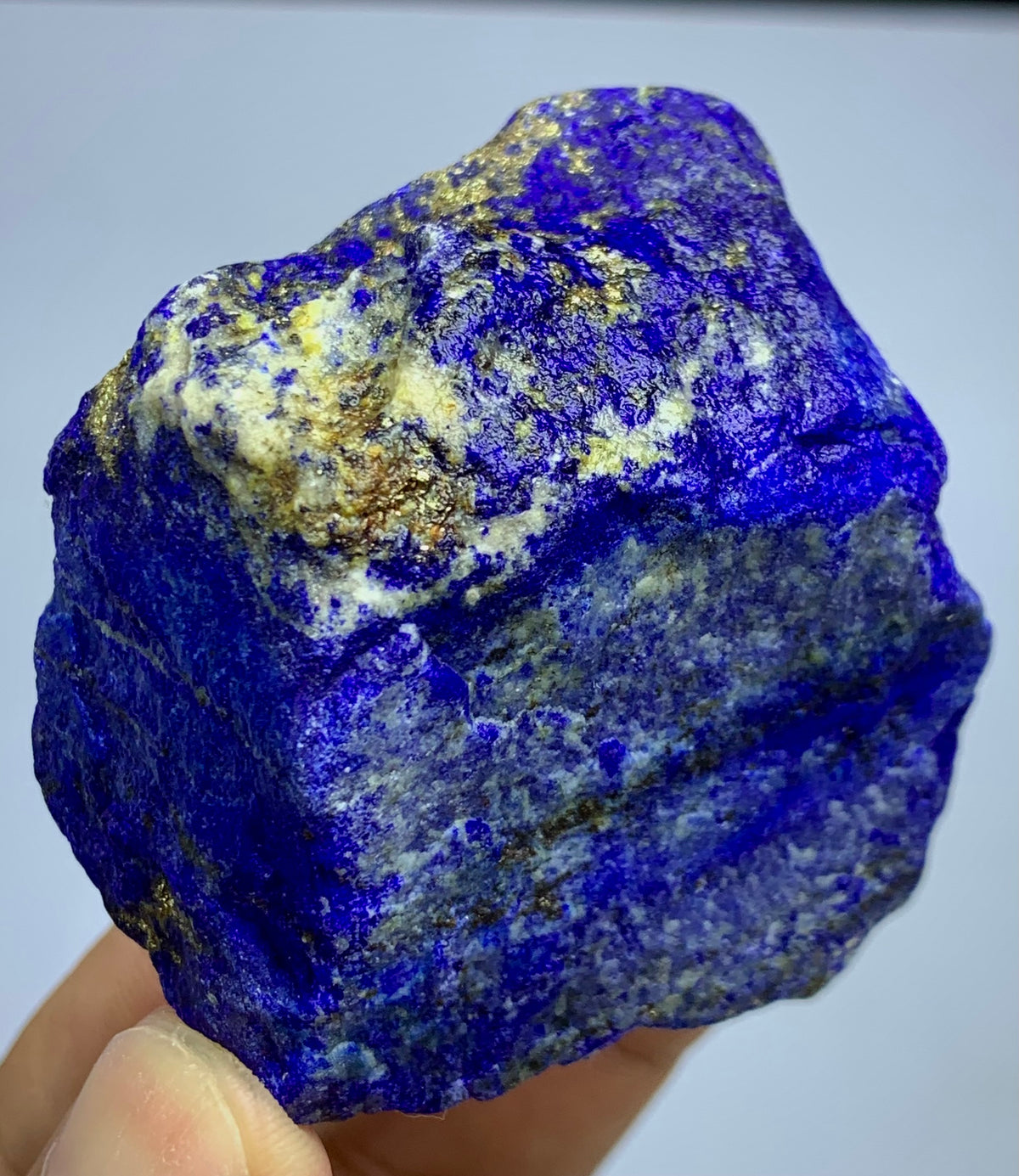 Close-up of royal blue Lapis Lazuli surface
Lapis Lazuli blocky specimen, top view
Raw Lapis Lazuli showing natural Calcite pockets