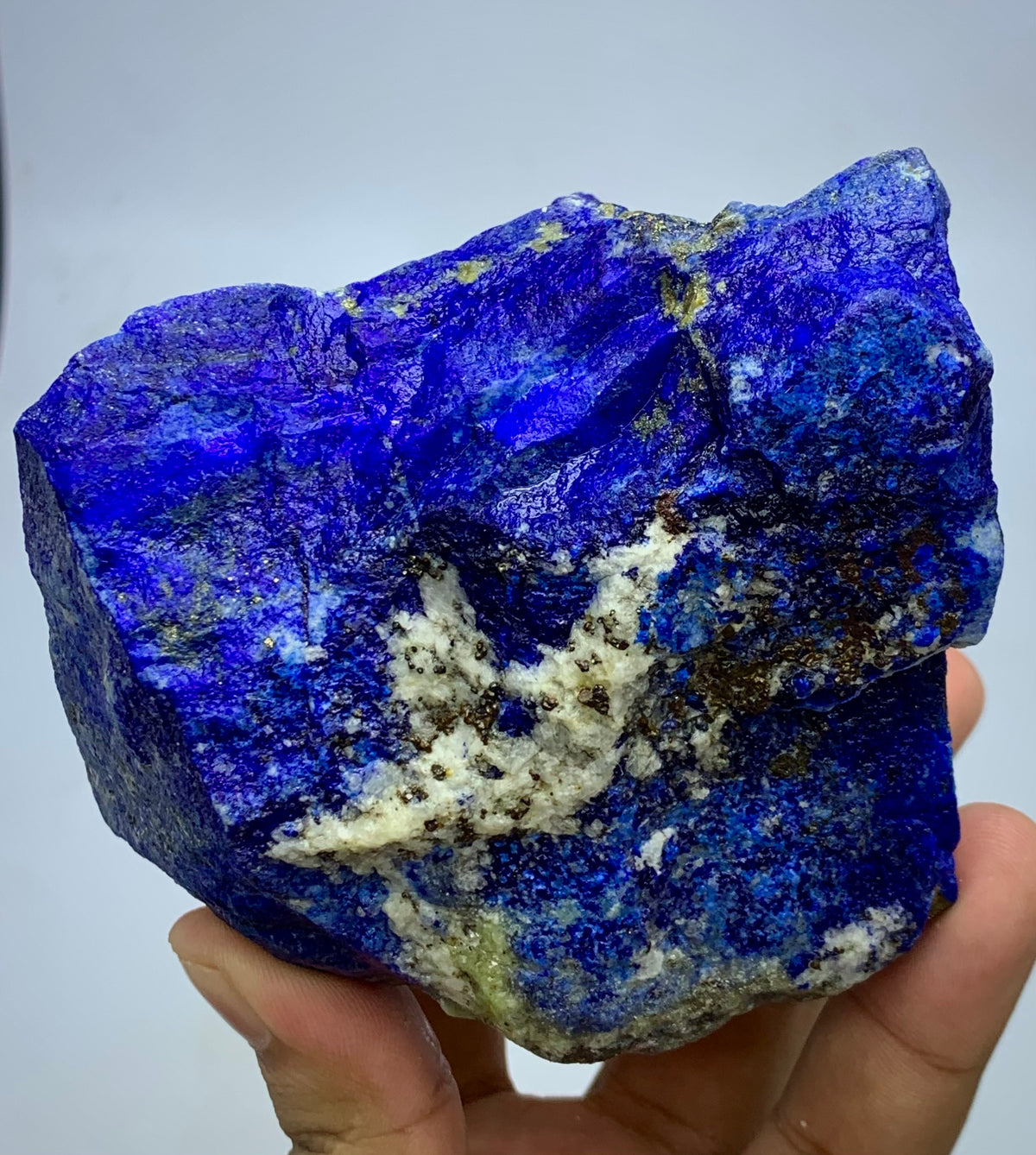 Badakhshan Lapis Lazuli, close-up on Pyrite cluster
Self-standing Lapis Lazuli boulder, flat base view
Afghan Lapis Lazuli, natural unpolished surface detail
Lapis Lazuli boulder displayed against neutral background