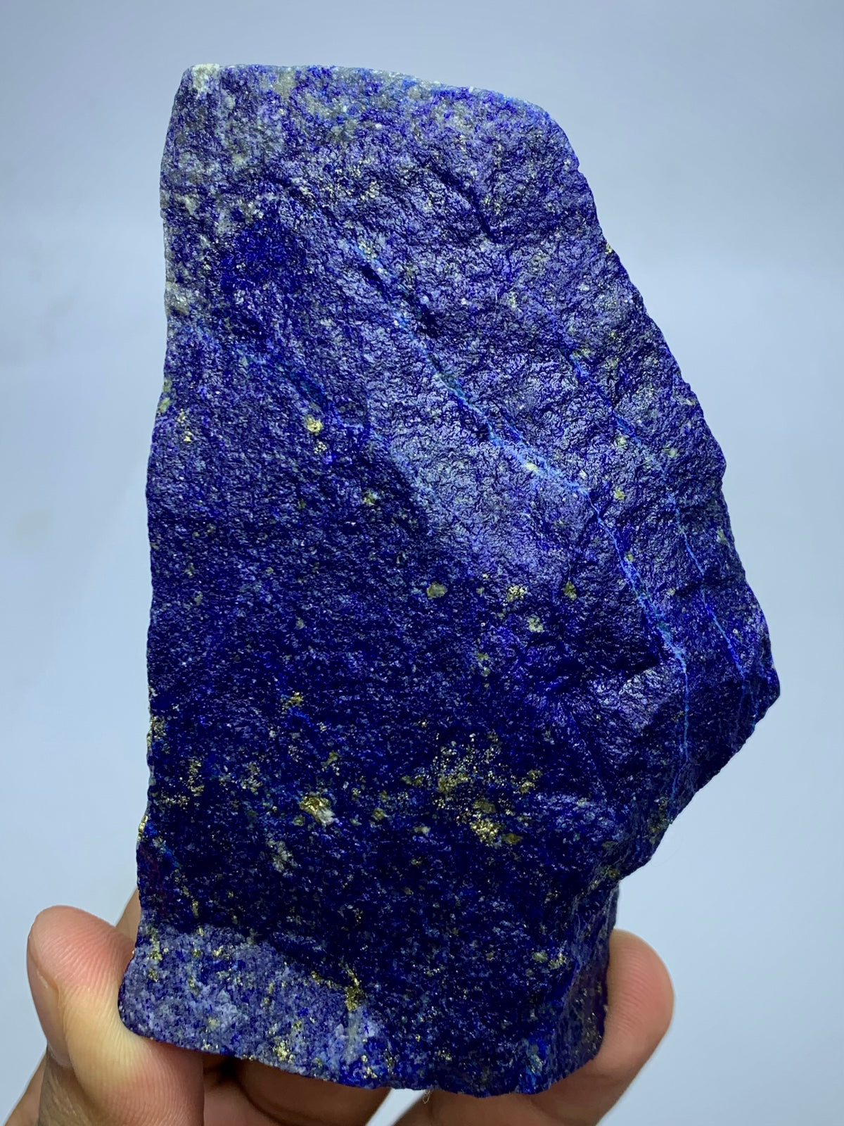 Lapis Lazuli elongated specimen, top view
Raw Lapis Lazuli showing natural Calcite pockets
