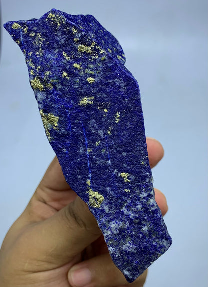 Raw Lapis Lazuli specimen showing white Calcite streaks
Afghan Lapis Lazuli, angled view highlighting depth
Lapis Lazuli elongated specimen, full piece overview
Detail shot of Lazurite blue coloring on rough specimen
366g Lapis Lazuli specimen with scale reference