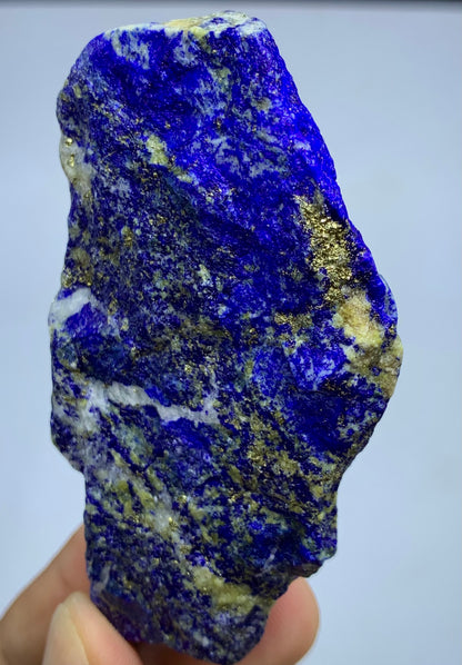 Raw Lapis Lazuli specimen showing white Calcite streaks
Afghan Lapis Lazuli, angled view highlighting depth
Lapis Lazuli thick specimen, full piece overview
Detail shot of Lazurite blue coloring on rough specimen
153g Lapis Lazuli specimen with scale reference
Badakhshan Lapis Lazuli, close-up on Pyrite cluster
Thick-profile Lapis Lazuli specimen, bottom view
Afghan Lapis Lazuli, natural unpolished surface detail
Lapis Lazuli specimen displayed against neutral background
Lapis Lazuli rough stone, macro deta