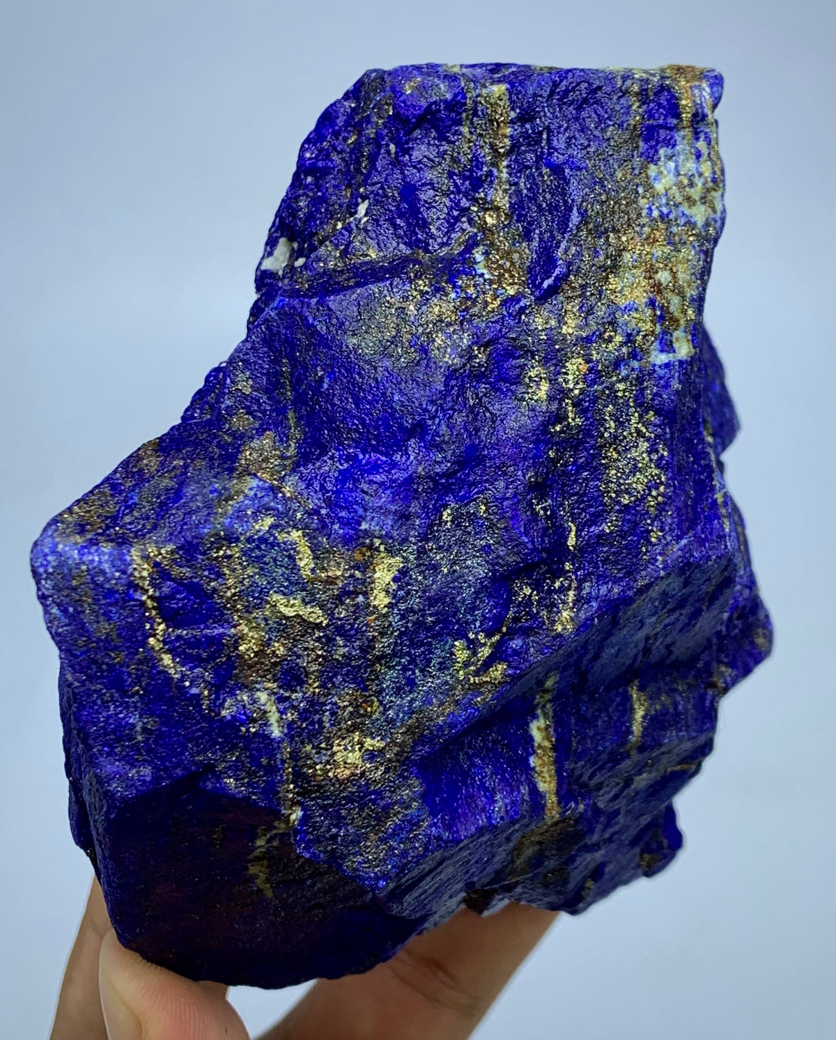 Lapis Lazuli boulder specimen, top view
Raw Lapis Lazuli showing natural Calcite pockets
Afghan Lapis Lazuli specimen, side profile view