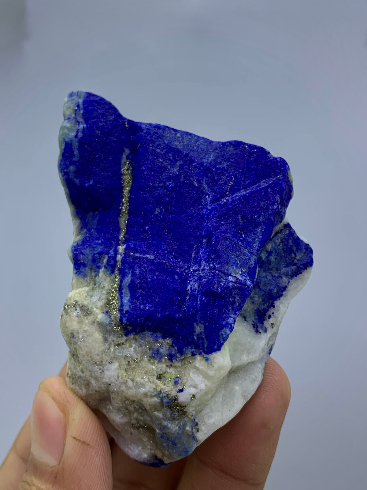 Raw royal blue Lapis Lazuli specimen from Badakhshan
Thick Lapis Lazuli cabinet specimen with golden Pyrite
