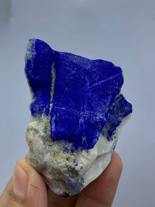 Raw royal blue Lapis Lazuli specimen from Badakhshan
Thick Lapis Lazuli cabinet specimen with golden Pyrite