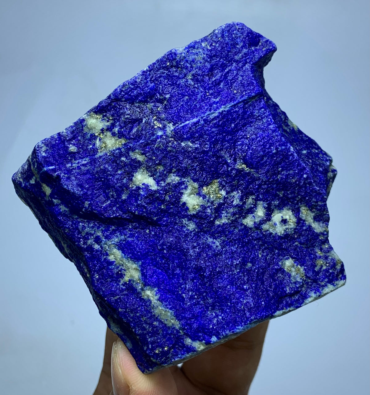 Macro of golden Pyrite on raw blue Lazurite
Rough textured surface of Badakhshan Lapis Lazuli