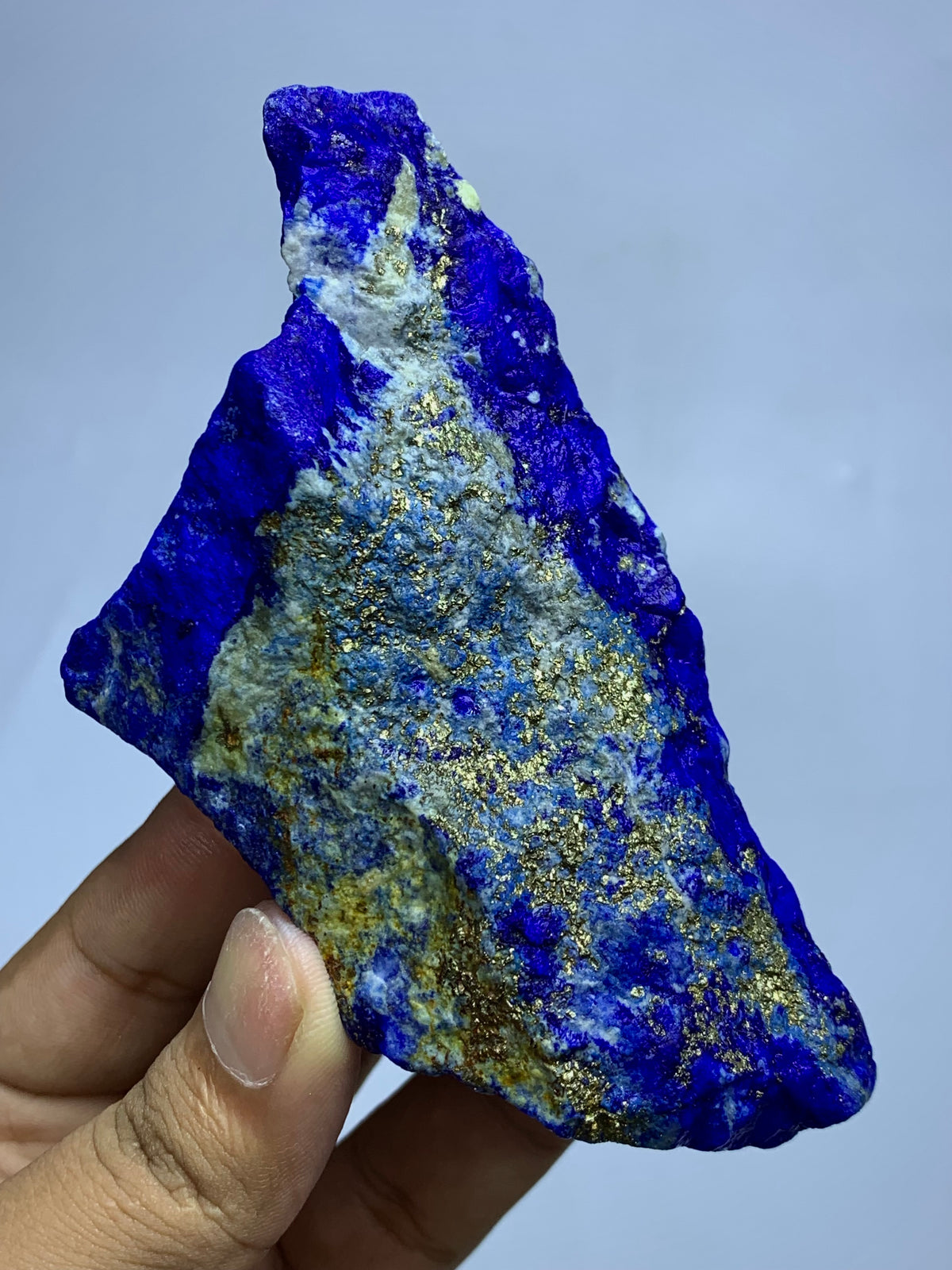 White Calcite lines through deep blue Lapis Lazuli
Narrow end showing 4.3 cm depth of Lapis Lazuli