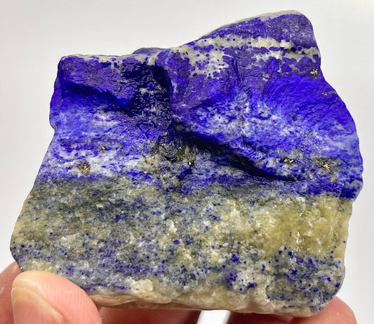 White Calcite streaking on raw Lapis Lazuli
Side angle of Badakhshan Lapis Lazuli piece
111g Lapis Lazuli slab with Pyrite specks
Front view of boxy Lapis Lazuli rough stone
Golden mineral inclusions on Lapis Lazuli face
Afghanistan-sourced Lapis Lazuli, natural surface
Lapis Lazuli specimen edge and depth detail